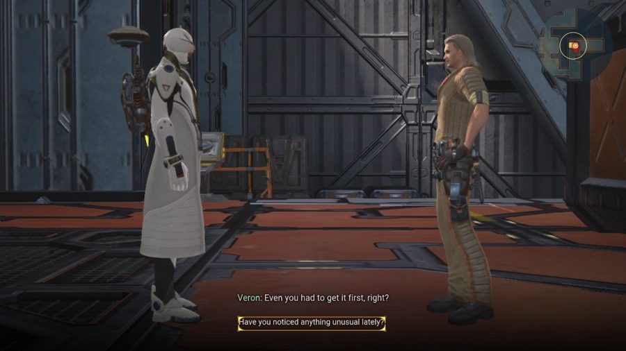 En paladin som pratar med en NPC inne i en fabrik i Skyforge on Switch