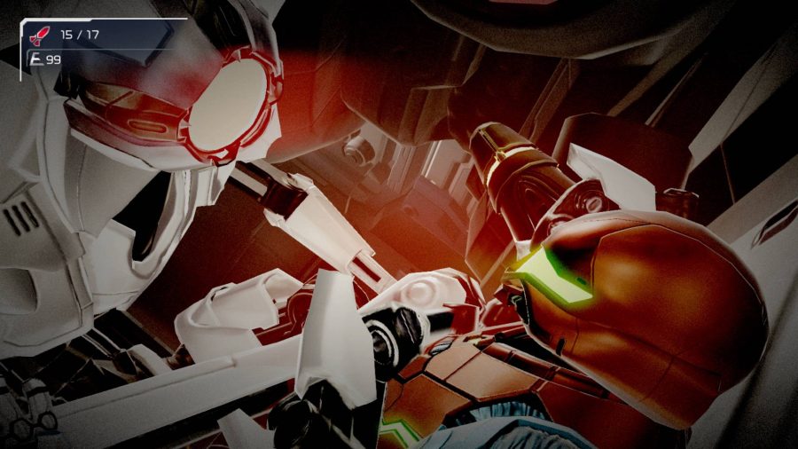 En EMMI -robot fäster ner Samus med robotarmar runt halsen, medan ett glödande rött ljus lyser från ansiktet